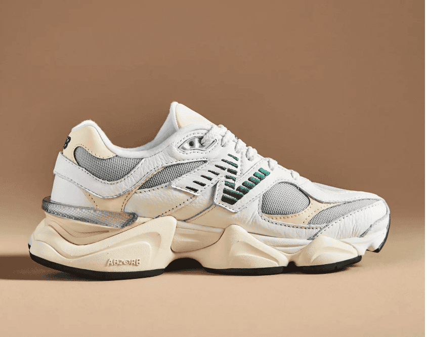 White new balance sneaker with green logo