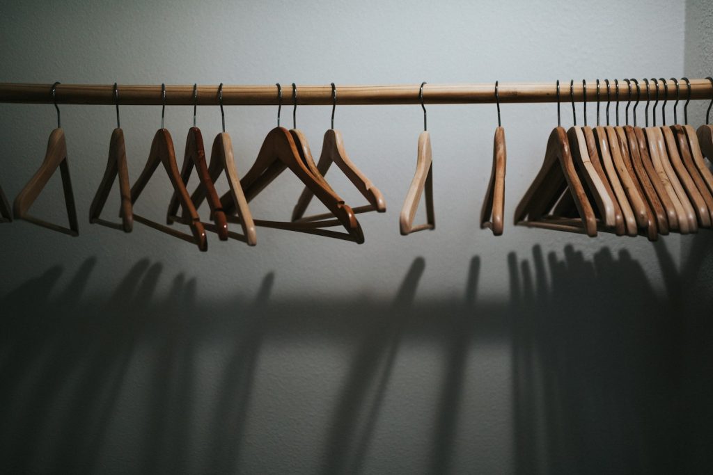 Wood hangers on rack to clean out your closet