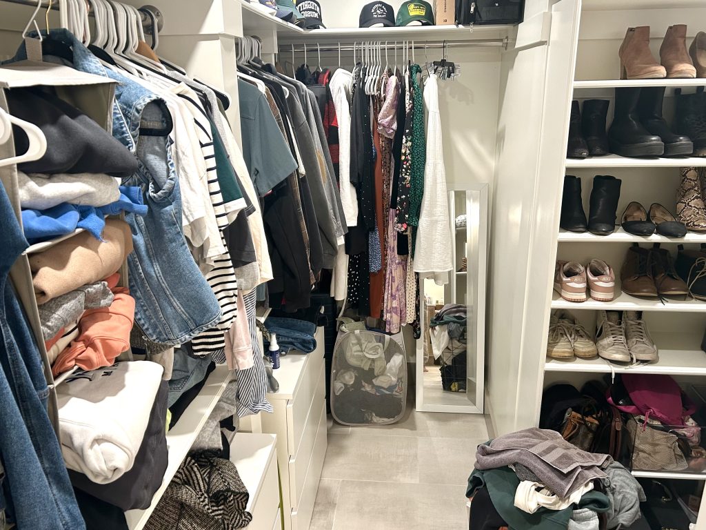 The Ultimate Closet Cleanout Plan - closet with clothes, hats and white dressers